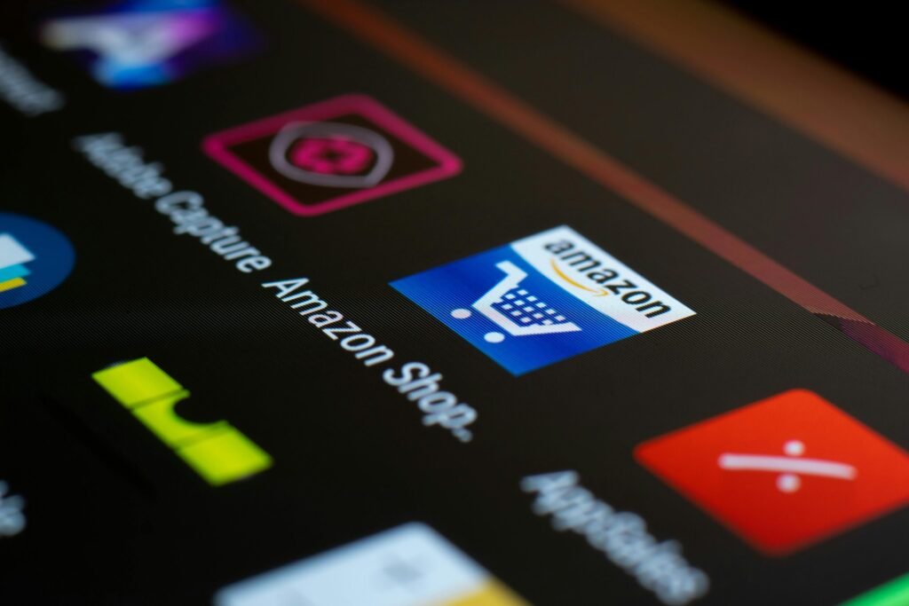 Amazon app icon on a smartphone screen, representing CRM marketing automation in B2B and B2C businesses.